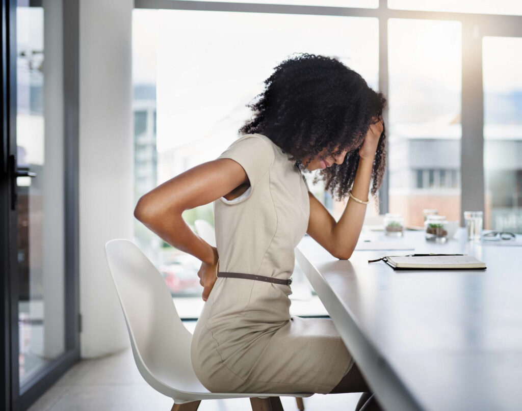 Woman sitting on chair stressed